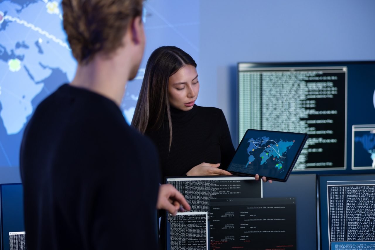 Cyber security team working in a Cyber Security Operations Center SOC to protect systems and