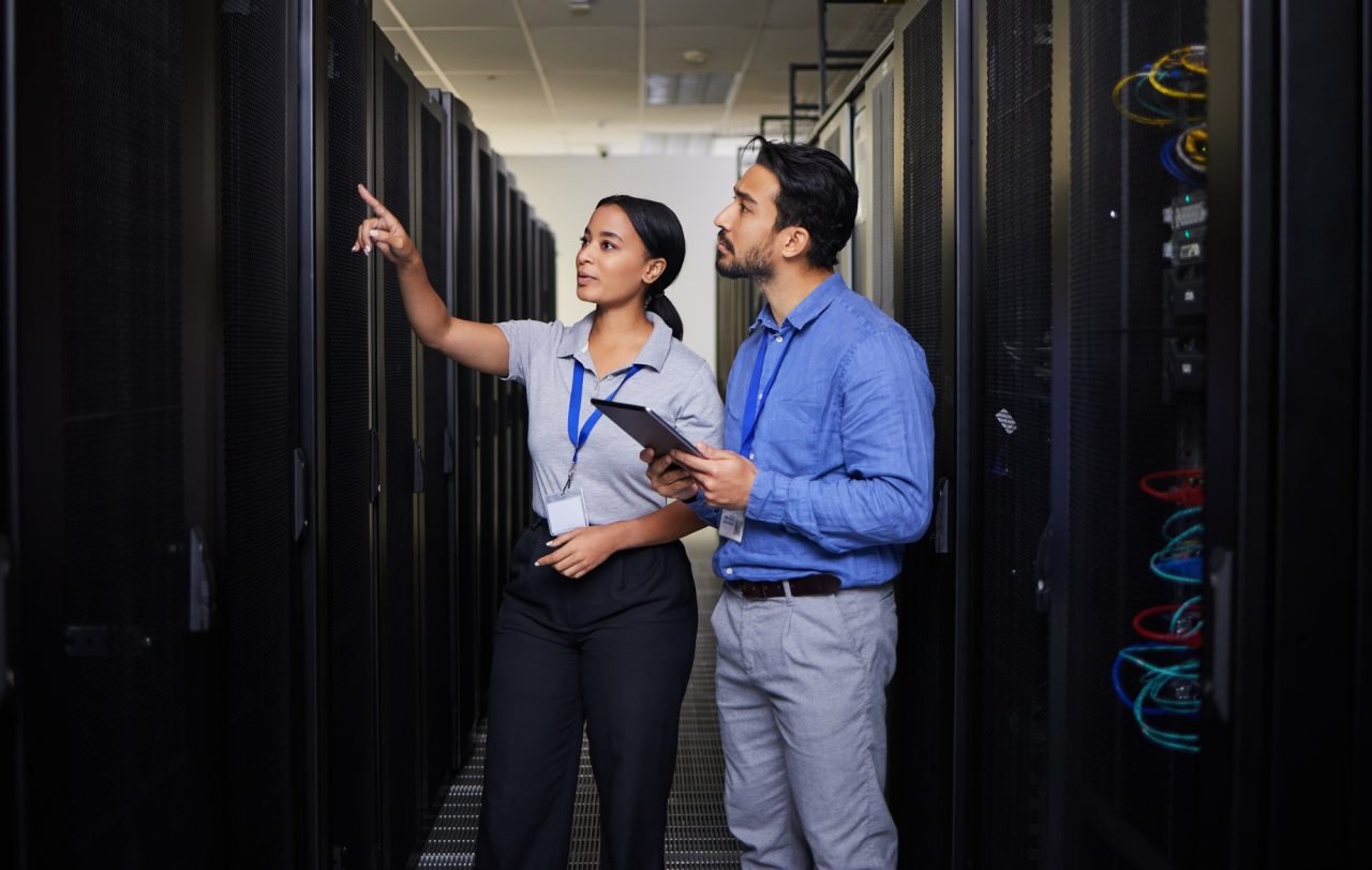 People, server room and engineering teamwork, inspection and tablet for cybersecurity, power or cod