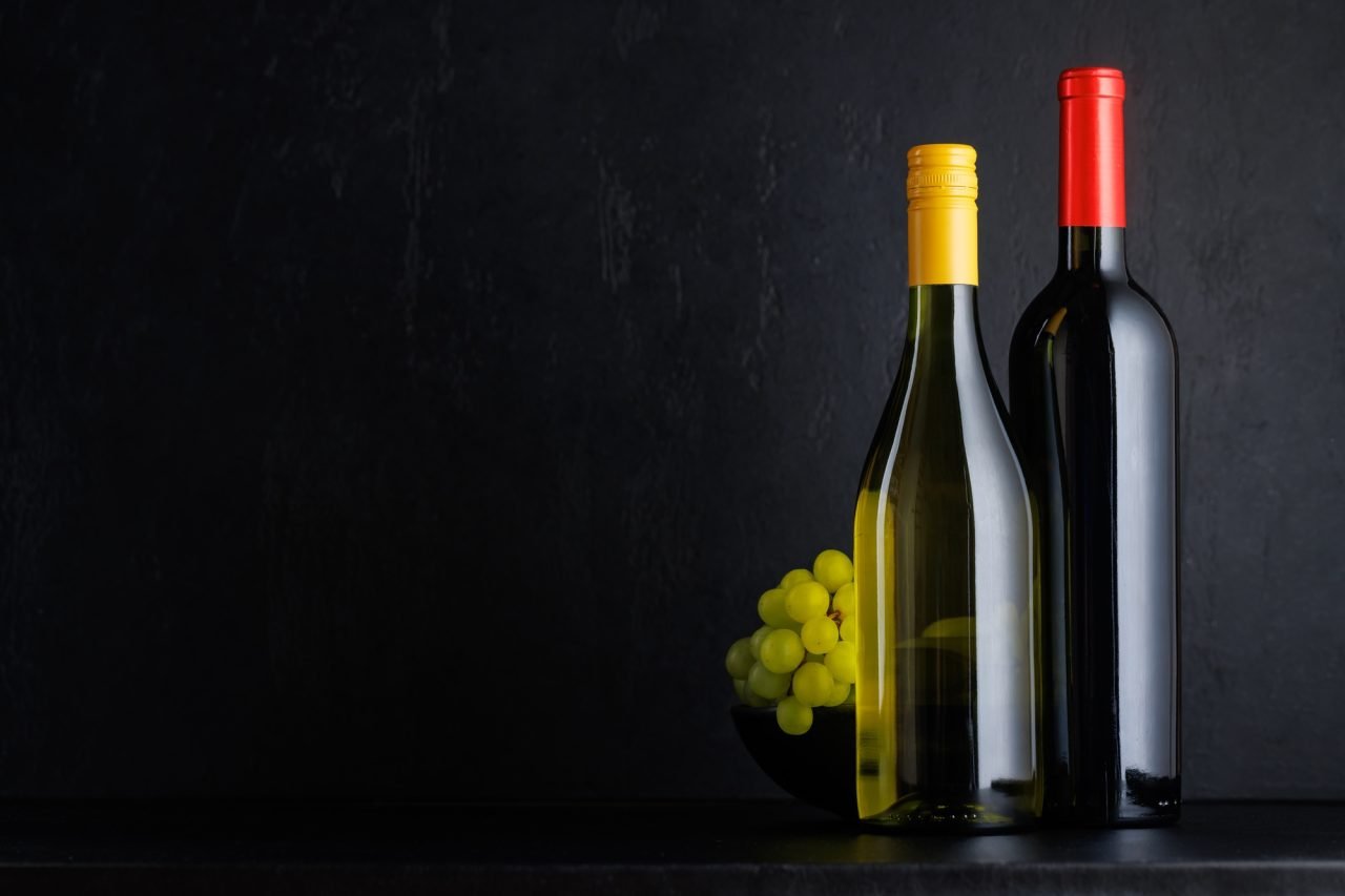 Various wine bottles over black